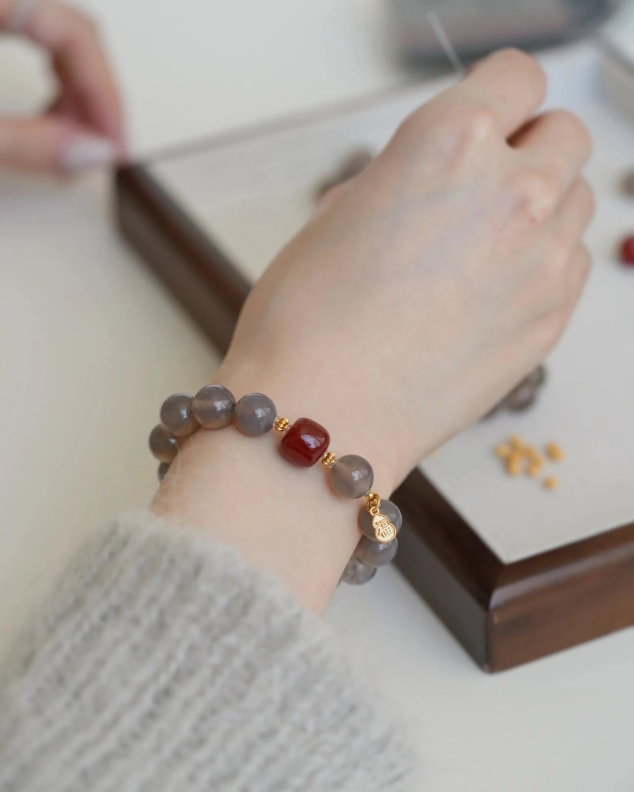 Red and Gray Agate bracelet for women worn on wrist with gold-plated S925 silver accents