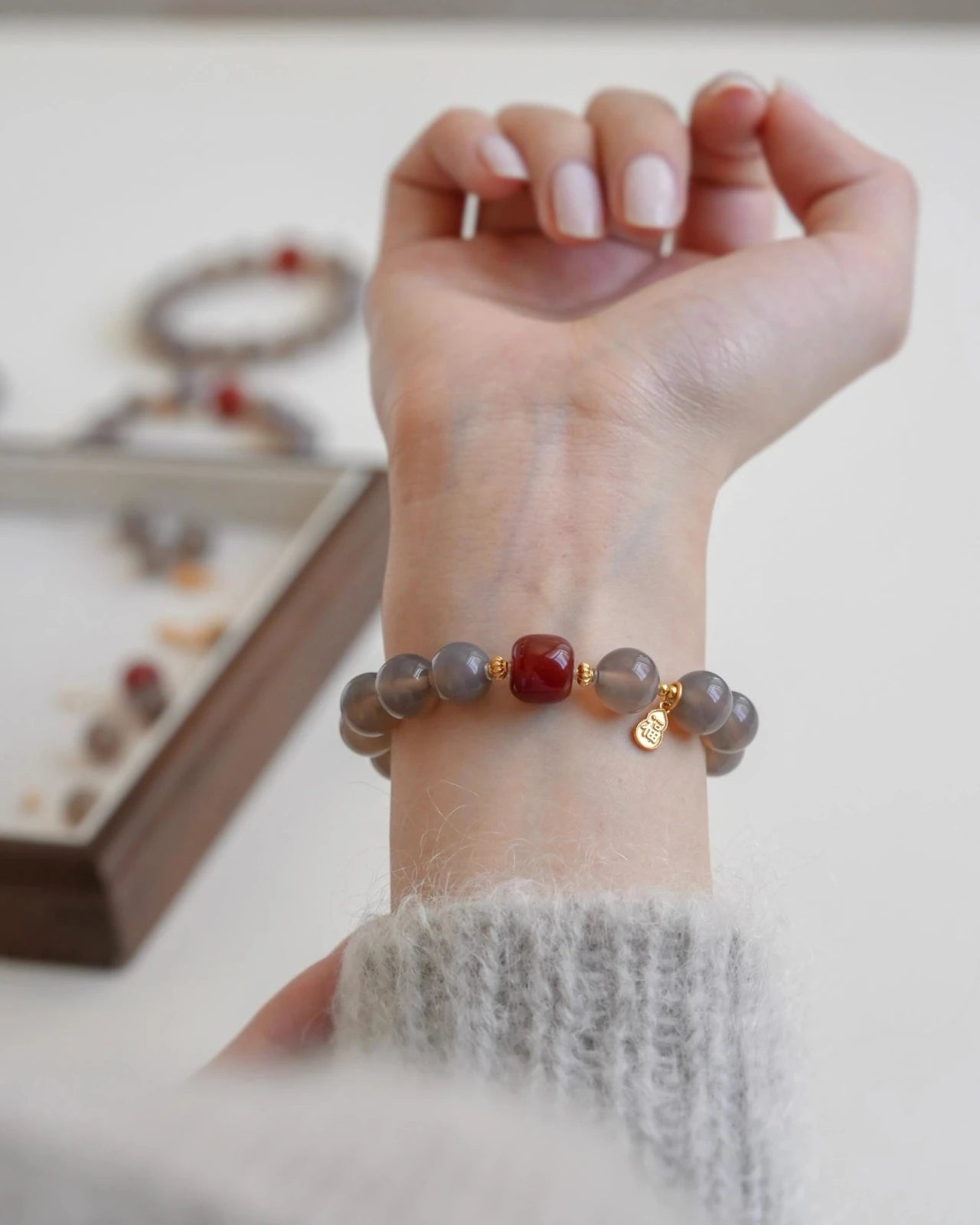 Balanced Energy Bracelet on wrist, natural Red Agate and Gray Agate gemstones for women