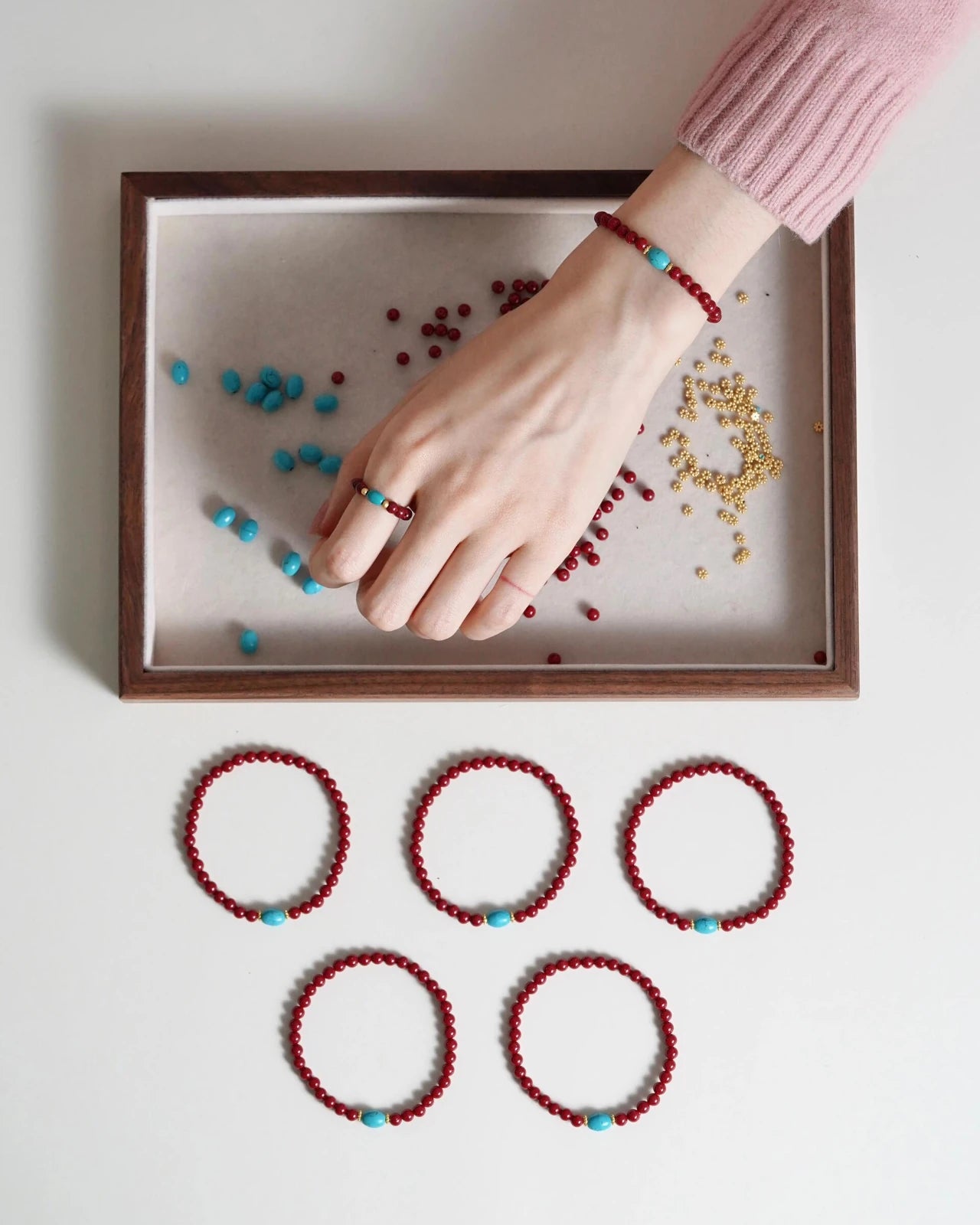 Cinnabar and turquoise prosperity bracelet worn on wrist for elegant style