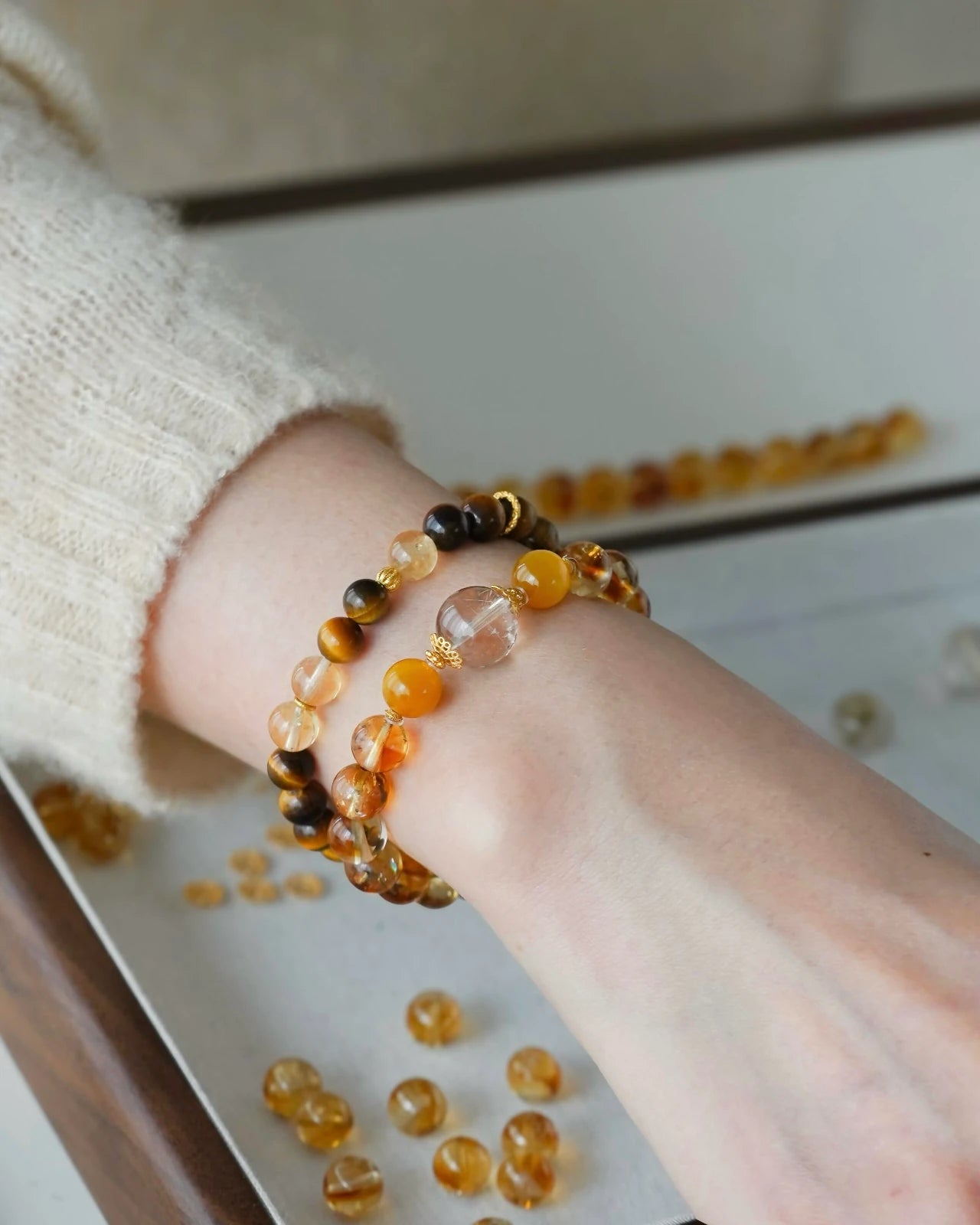 Lifestyle wrist stack—citrine bracelet layered with tiger’s eye; gold-plated S925 accents for everyday confidence and focus.