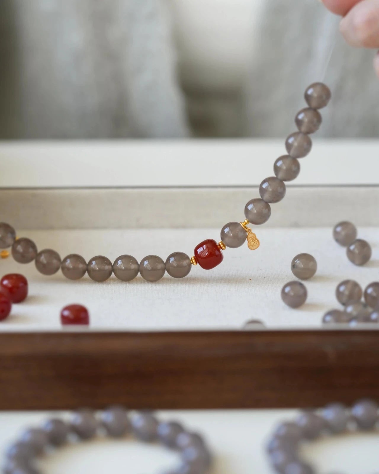 Handmade Balanced Energy Bracelet in Red Agate and Gray Agate, jewelry crafting process
