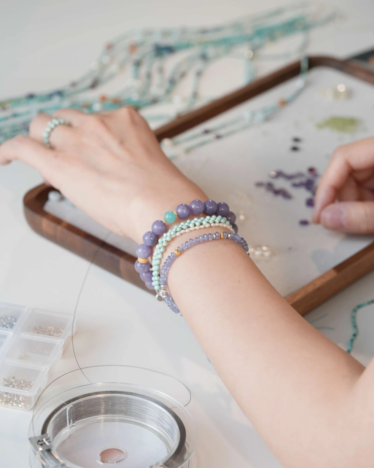 Handmade Lavender Tide Serenity Bracelet worn during jewelry crafting