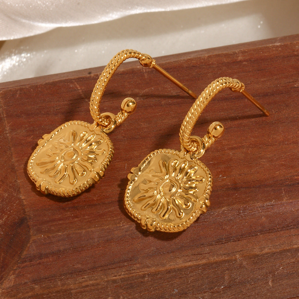 Sunburst Medallion Twisted Hoops